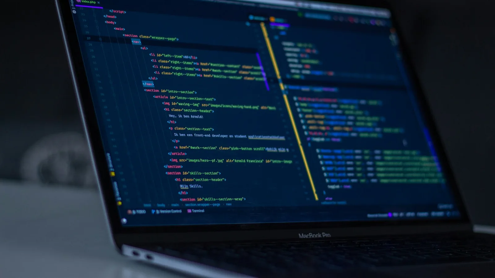 A laptop displaying code in a text editor