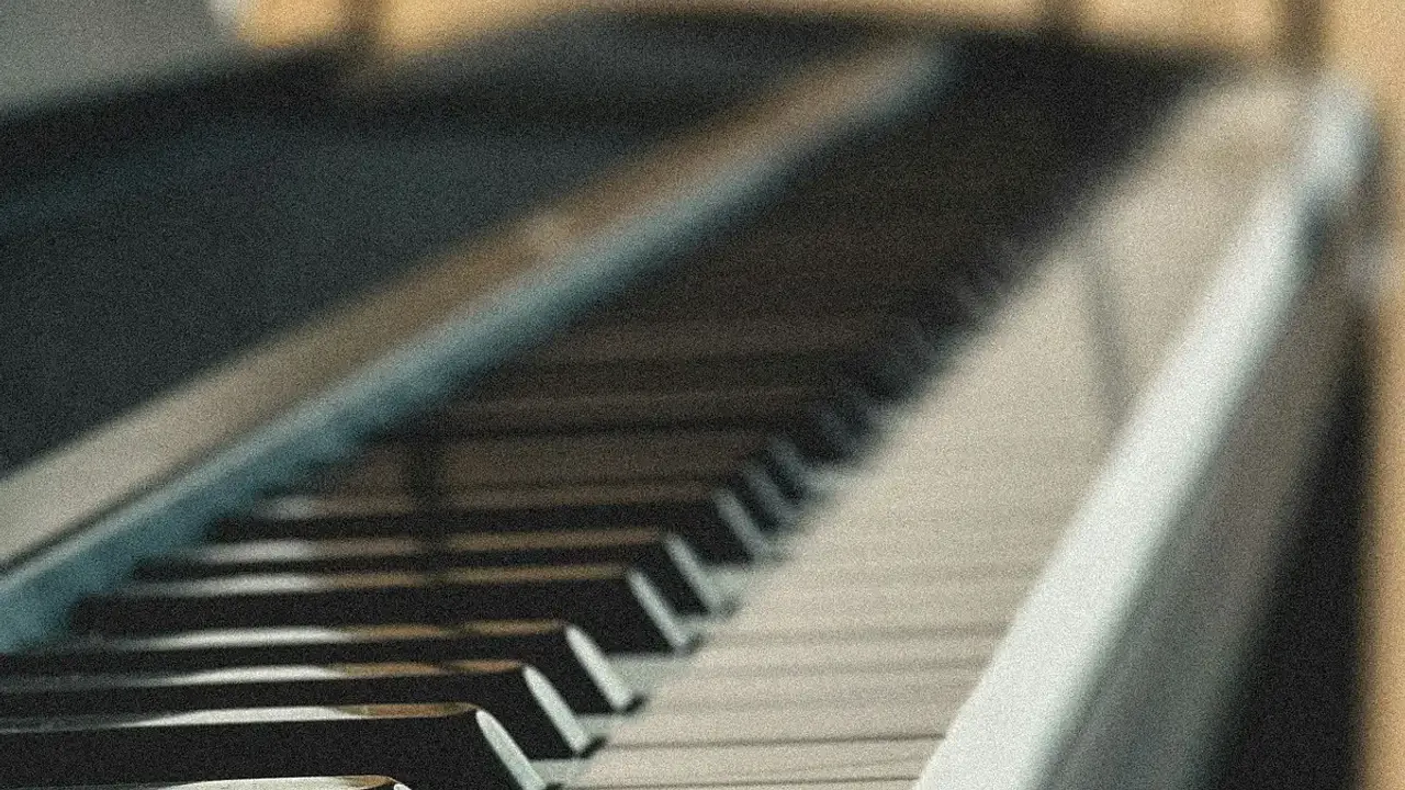 Close-up of piano keys with a softly blurred background