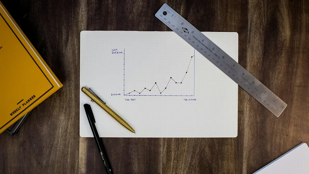 A pen and planning notes on a sheet of paper