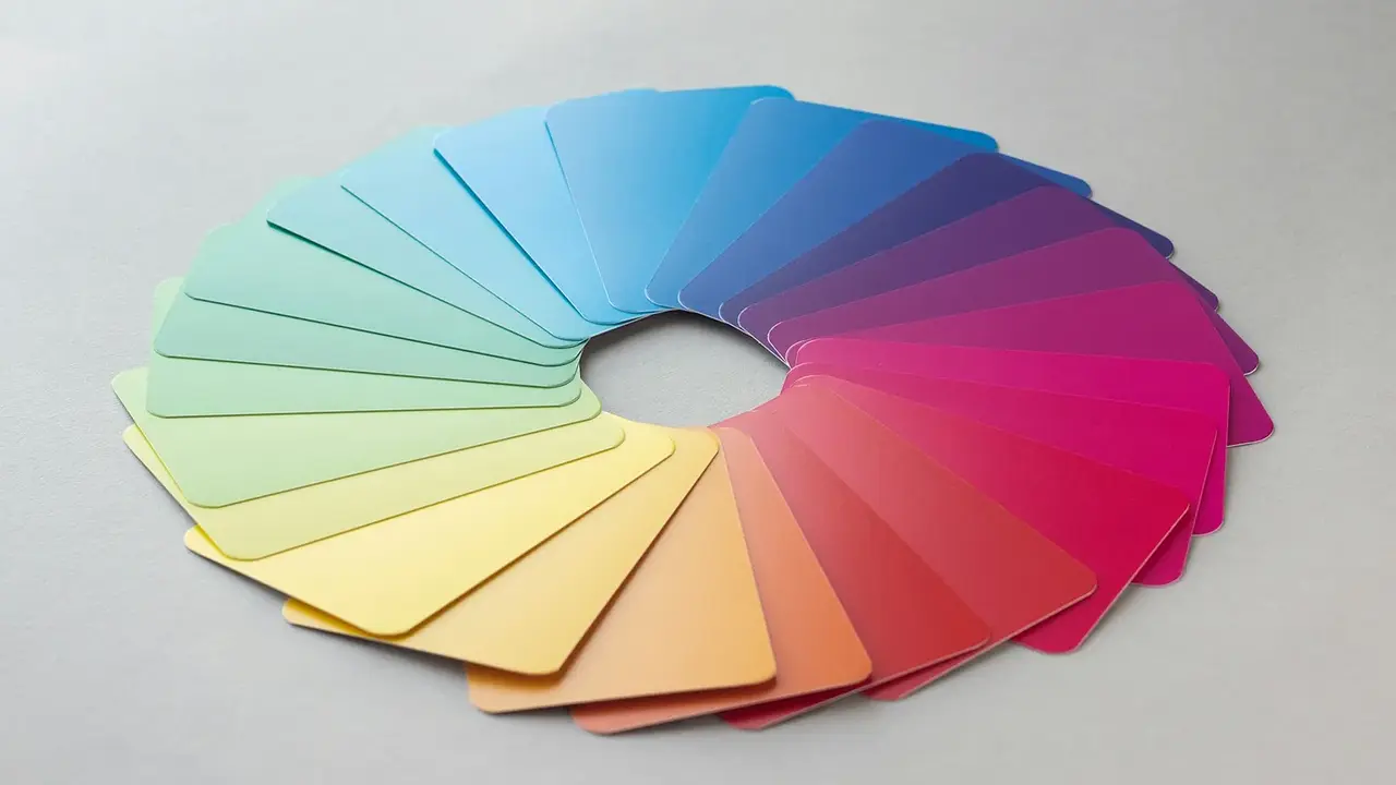 A circular fan of color swatches on a white surface