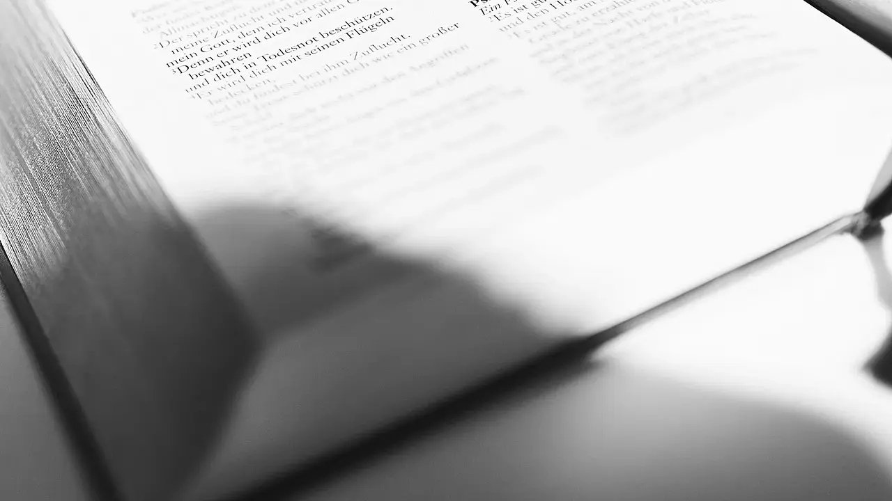 A microphone resting on a page of written notes