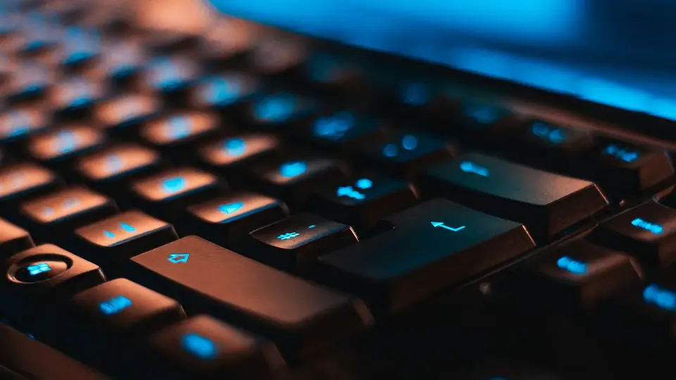 A close view of a backlit computer keyboard