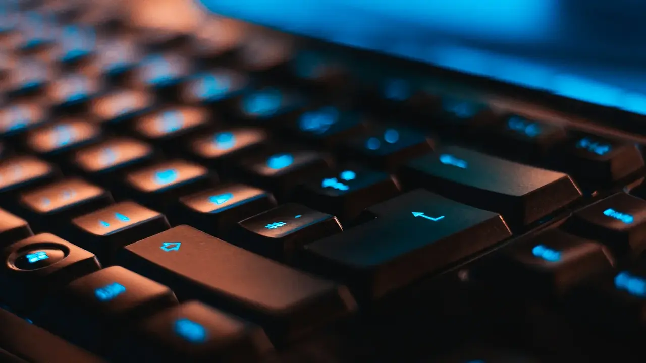 A close view of a backlit computer keyboard